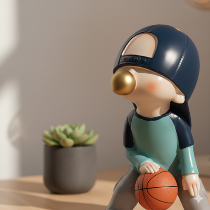 Figura De Poliresina Niño Con Chicle Azul Basquetbol 23 Cm